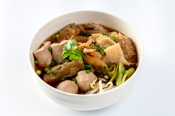 Stewed Beef and Offal Noodle Soup, Thai Stew Food and Vegetables in Bowl on White Background