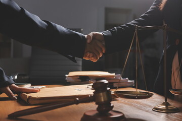 Attractive young lawyer in office Business woman and lawyers discussing contract papers with brass...