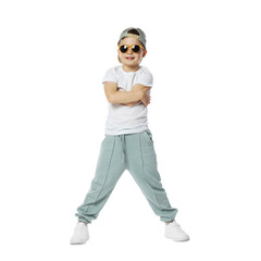 Happy little boy in sunglasses and baseball hat dancing on white background
