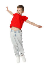 Happy little boy dancing on white background