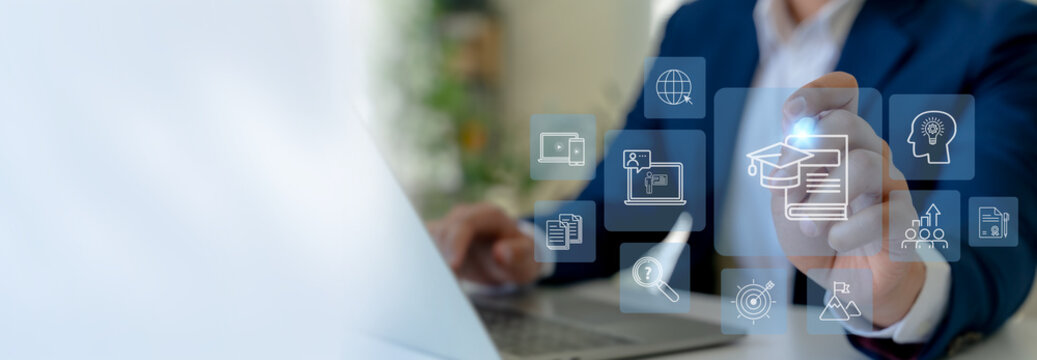 Online Education and E-Learning Concept. Interacts with virtual education icons on a digital interface, remote and online learning, digital training, webinars on the internet for personal development. - Powered by Adobe