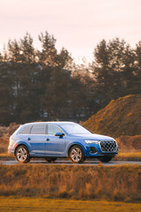 Automobile cruising through countryside