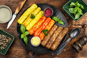 Fresh uncooked sausages on a plate.