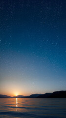a a movement of stars in the night sky with the view of mountains..