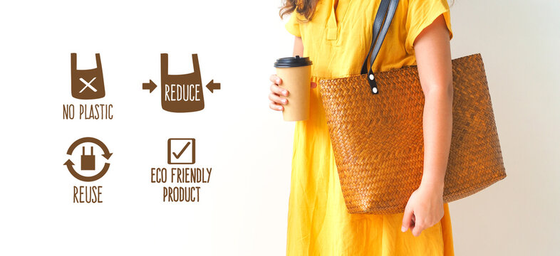 Woman holding  bamboo woven bag on white background. Handmade weave bag. Reusable shopping bag. Natural material. Zero waste. Plastic free. Eco friendly concept.