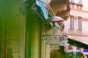Ornate Crystal Chandelier Lamp on Building Exterior