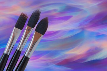 Paintbrushes on vibrant abstract background
