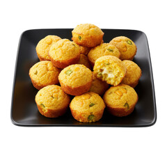 Freshly baked corn muffins displayed on a black plate, showcasing a delicious treat