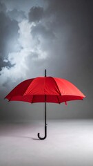 A bright red umbrella in the middle of a gray or cloudy atmosphere