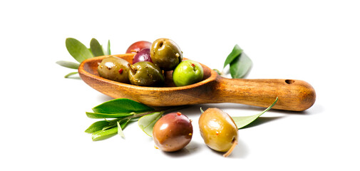 Olives in wooden spoon, homemade marinated colorful olives with herbs and spices isolated on white background, in a rustic wood spoon, closeup. Olive oil,  Healthy Mediterranean vegan food. 