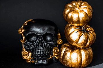 Scary black skull with golden roses, pumpkins and candles for Halloween or Day of the Dead party on black background.