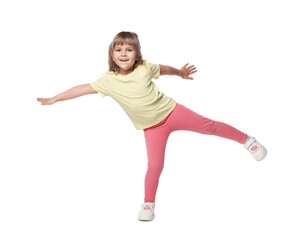 Happy little girl dancing on white background