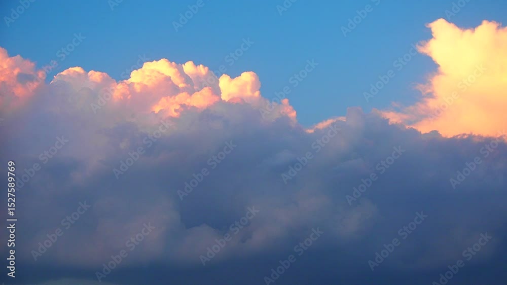 Poster Soft pastel colors paint the sky as fluffy clouds gather, creating a captivating view. The shifting hues blend seamlessly, inviting reflection and awe during twilight