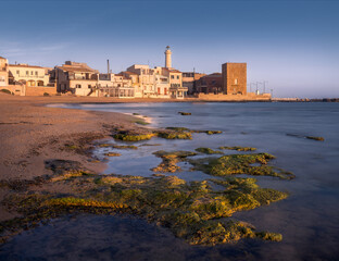 Golden Hour Casts Enchanting Light Over Punta Secca Shores in Sicily, Italy