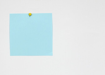 blue Sticky Note with Yellow Pin on Left Side, copy space