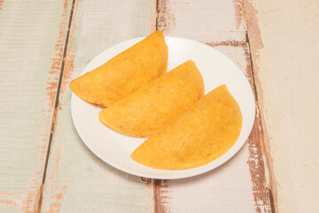 Venezuelan empanadas are another culinary gem, made with precooked corn flour and fried until crispy.