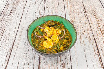 A vibrant blend of Portuguese influences, with a strong emphasis on seafood, vinegar, and coconut.