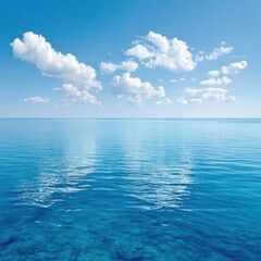Bright blue ocean water shimmers beneath a vibrant sky with white clouds.