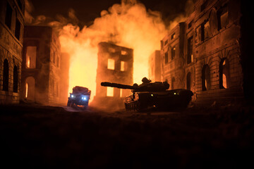 War Concept. Military silhouettes fighting scene on war fog sky background, World War Soldiers Silhouette Below Cloudy Skyline At night. Battle in ruined city.