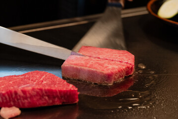 raw beef steak on grill