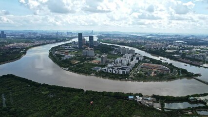 Aerial view of Guangzhou International BioIsland and Pearl River Delta during the day with city background