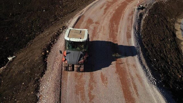 Orange road rollers compacting an access ramp on the Sofia ring road