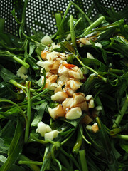 fresh water spinach or morning glory with chopped garlic, chili and oyster sauce