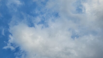 White cloud on blue sky background panorama, bright sunny day on summer winter season day. Light...