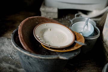 outdoor sink with lots of dirty dishes