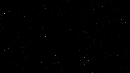 Snowstorm texture. Bokeh lights on black background, shot of flying snowflakes in the air. 