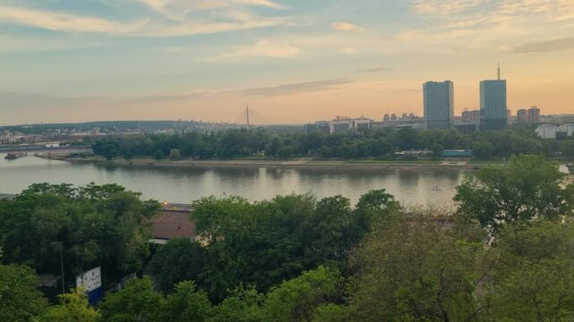 Golden hour view from Kalemegdan Fortress over New Belgrade and the calm Sava River at sunset