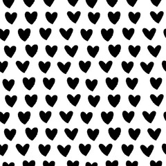 Cute black and white seamless pattern with ink hearts. Vector hand-drawn illustration in doodle style. Perfect for print, wallpaper, decorations, textiles.
