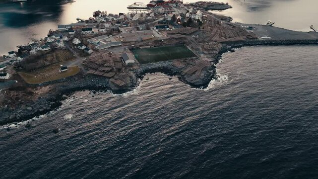 Reine Fishing Village, Soccer Field, And Hjeller Til Torrfisk In Nordland, Norway. - aerial shot