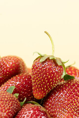 Macro fresh whole strawberry, vertical background, space for text.