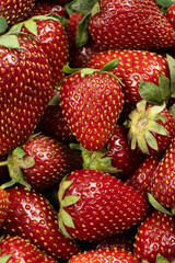 Many fresh strawberries top view. Organic berry texture background.
