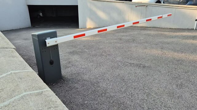 Red white gate barrier for underground car parking