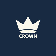 A sleek geometric crown logo in monochrome, designed with clean lines and sharp angles, placed against a dark background