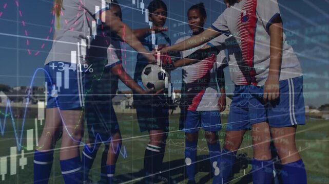 Goalkeeper holding ball and teammates stepping in forming sports team circle before match kickoff
