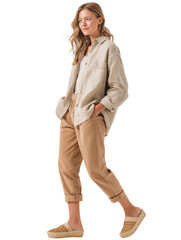 Young long-haired woman wearing beige slacks and an oversized shirt, standing with hands tucked in pockets. Isolated object with transparent background