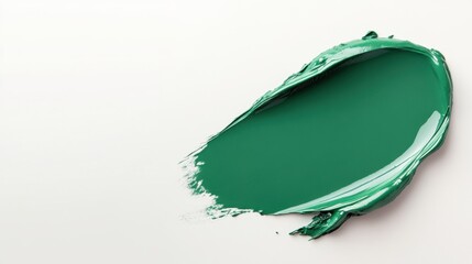 Fototapeta premium Vibrant green paint smear on a neutral background ideal for creative projects