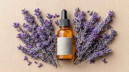 Lavender essential oil surrounded by fresh lavender flowers on beige background