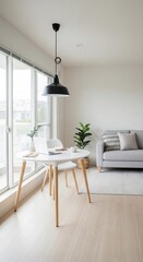 Fototapeta premium Bright, modern room featuring a gray sofa, a white dining table, a potted plant, and large windows letting in natural light.