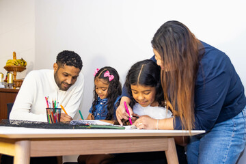Family drawing together at home, cultivating creativity and bonding