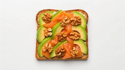 A beautifully arranged open-faced sandwich topped with avocado, smoked salmon, and walnuts on whole-grain bread.