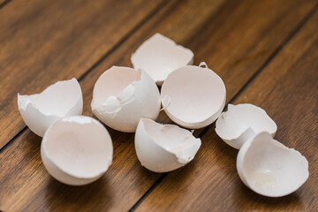 broken egg shells on wooden background