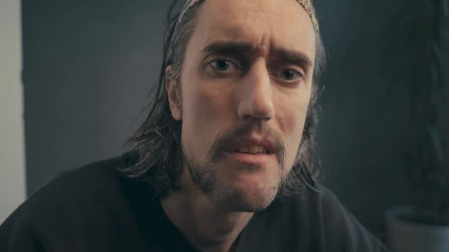 Close-Up of Expressive Middle-Eastern Man Conveying a Range of Emotions: From Seriousness to Playfulness in a Series of Subtle Facial Movements, Creating Viewer Connection