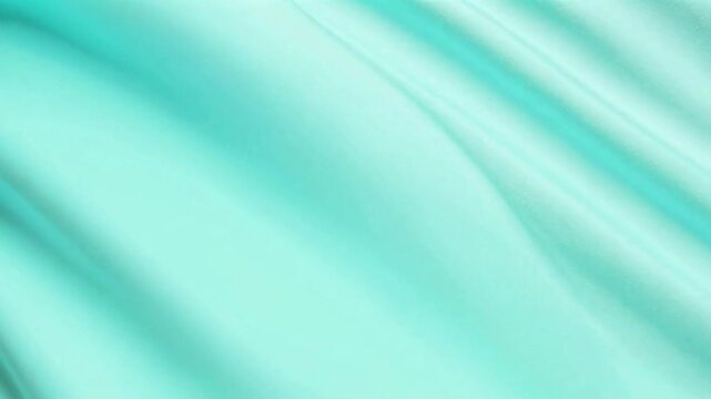 Faintly creased aquamarine cloth surface with light variation and diagonal movement
