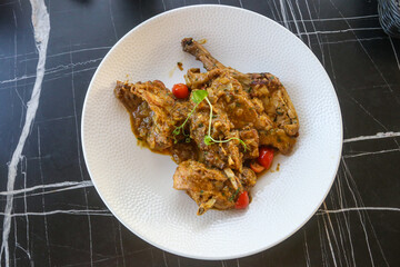 Traditional maltese national dish stewed rabbit on the table in restaurant