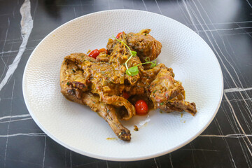 Traditional maltese national dish stewed rabbit on the table in restaurant