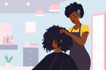A black woman working as a hairdresser in a salon or small business. An African American person giving her client with curly hair a stylish hairstyle and beauty treatment with professional care